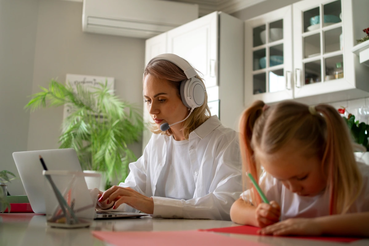 mother-working-from-home-trying-balance-family-life-with-child-job_1