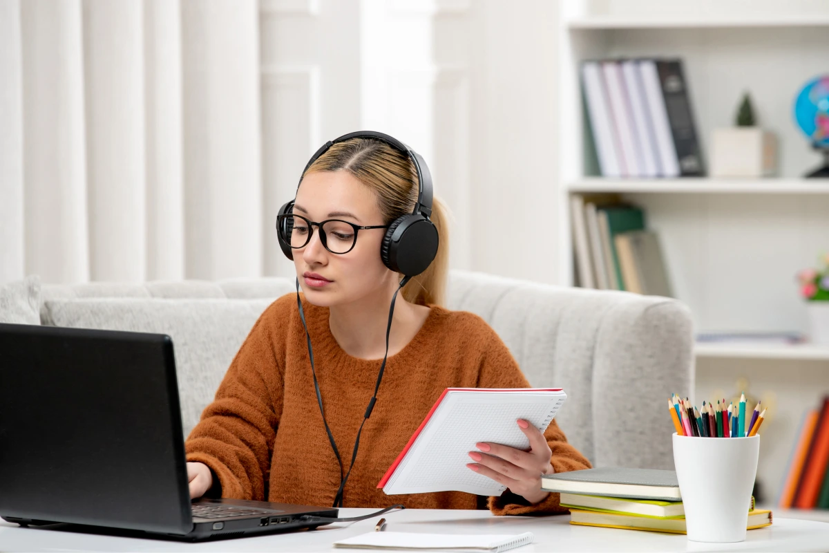 student-online-cute-girl-glasses-sweater-studying-computer-typing-keyboard 1