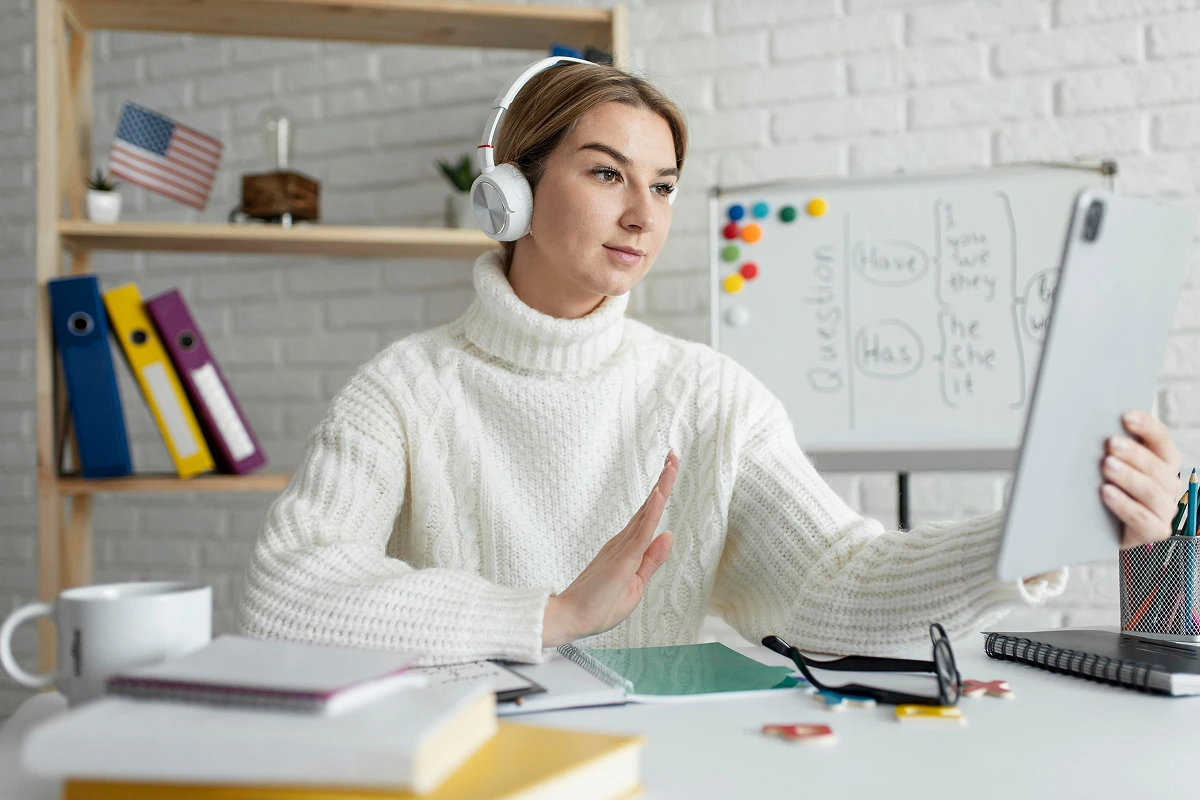 young-woman-teaching-kids-english-lesson-online 1