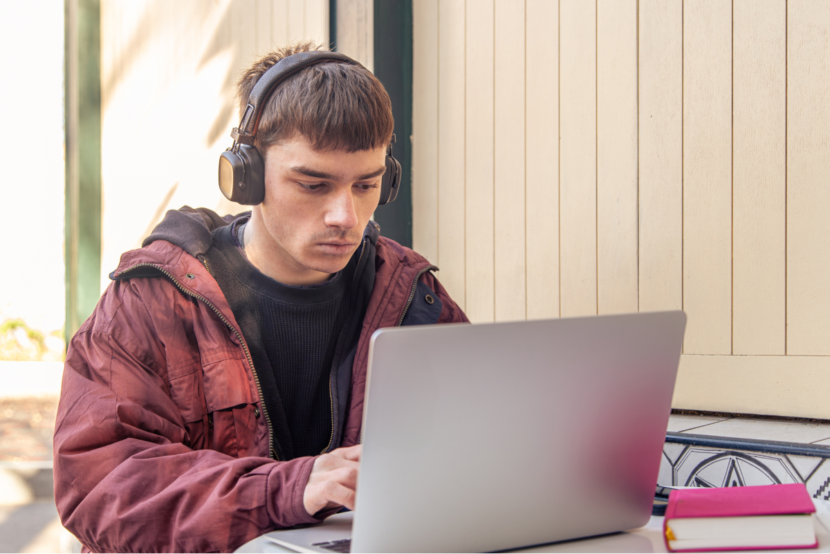 student-studies-using-laptop-male-student-studying-online 1