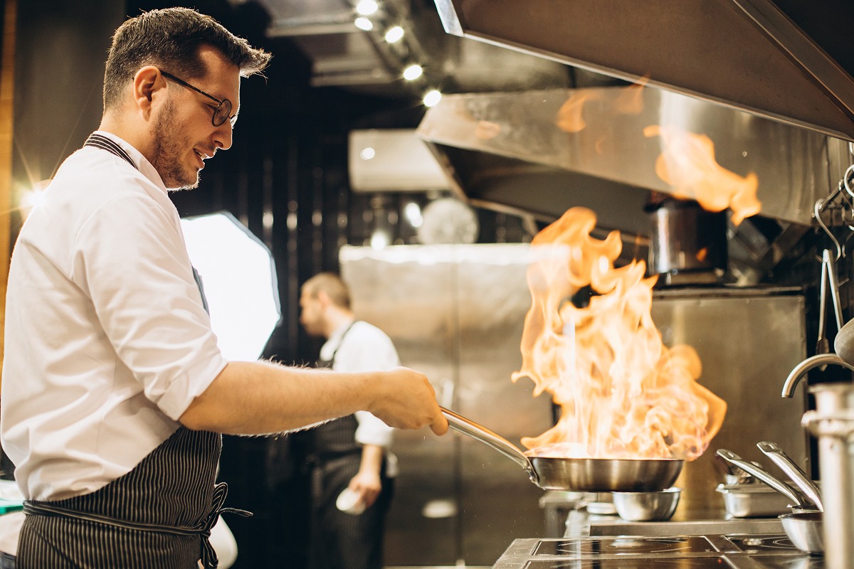 man-chef-frying-meat-pan-fire 1